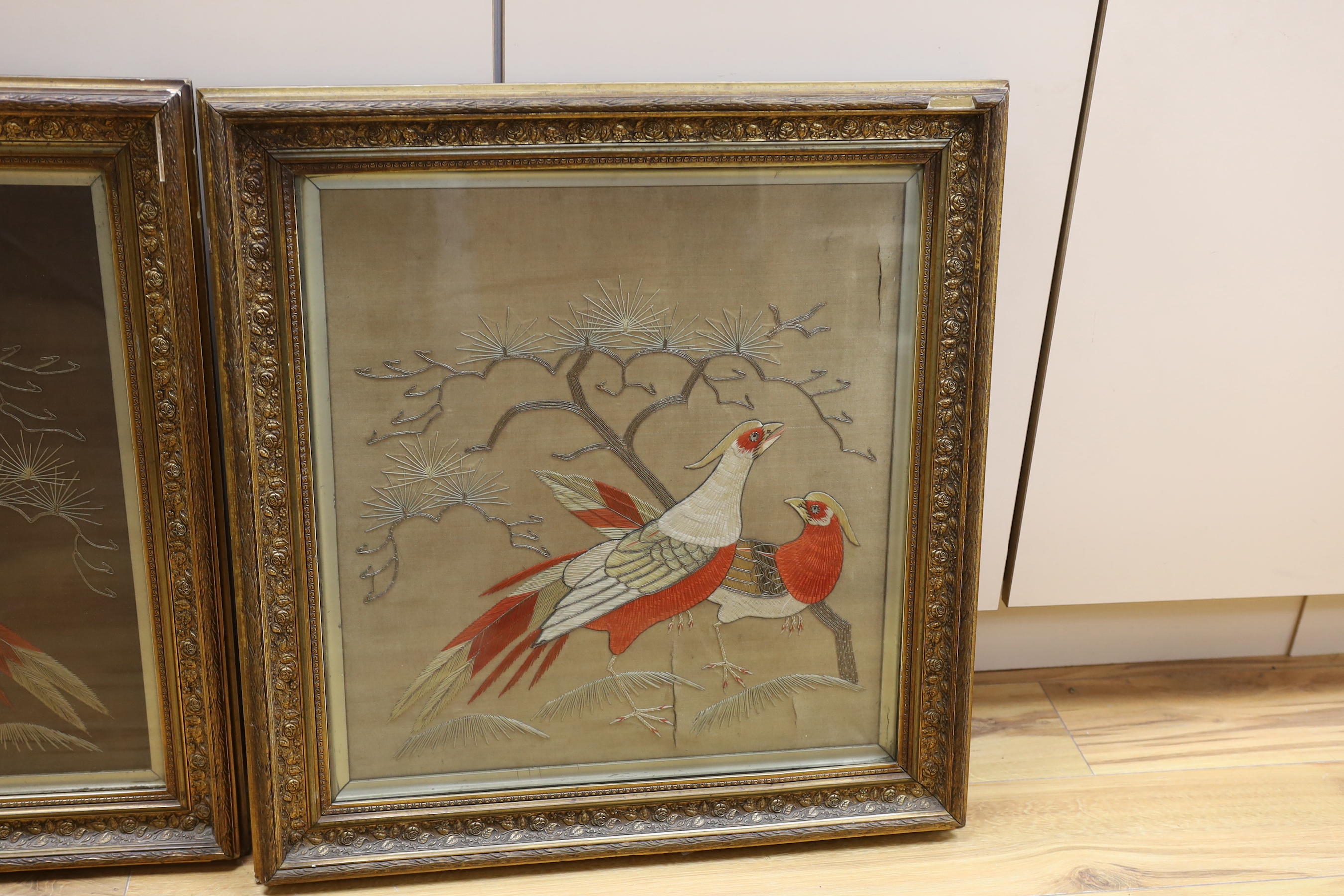 A pair of Japanese bird wool works in painted gilt frames